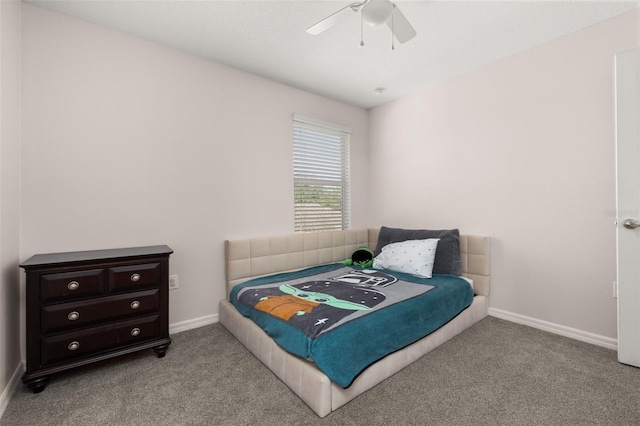 bedroom with ceiling fan, baseboards, and carpet floors