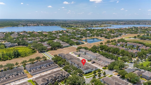 aerial view featuring a residential view and a water view