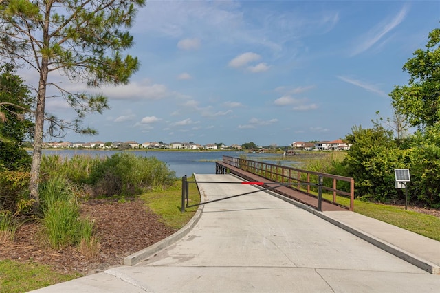 view of home's community with a water view