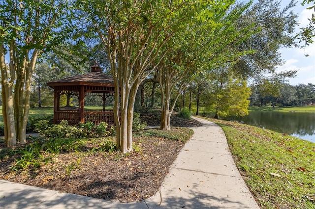 view of community with a gazebo and a water view