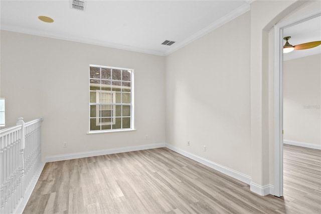 850 Spring Oak Cir, Orlando, FL 32828 - empty room with wood finished floors, baseboards, crown molding, and arched walkways