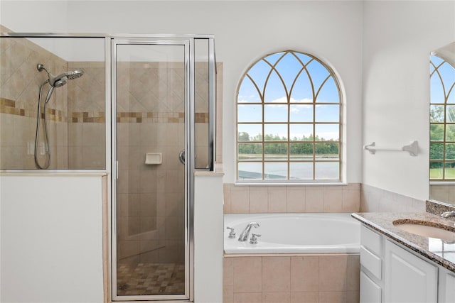 850 Spring Oak Cir, Orlando, FL 32828 - full bath with vanity, a shower stall, and a garden tub