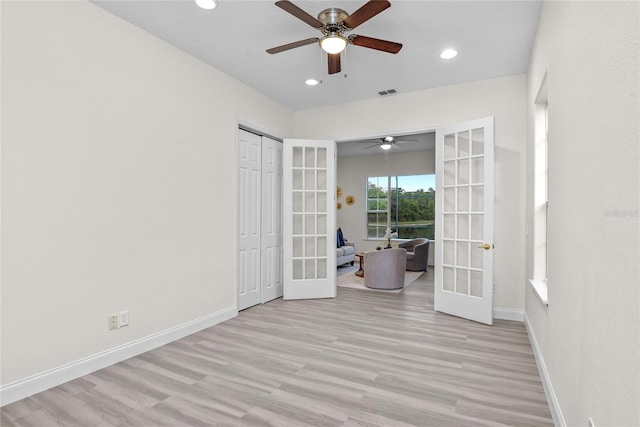 850 Spring Oak Cir, Orlando, FL 32828 - unfurnished bedroom with french doors, wood finished floors, baseboards, recessed lighting, and a ceiling fan