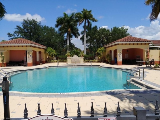 20310 Estero Gardens Cir Unit 203, Estero, FL 33928 - community pool featuring a patio