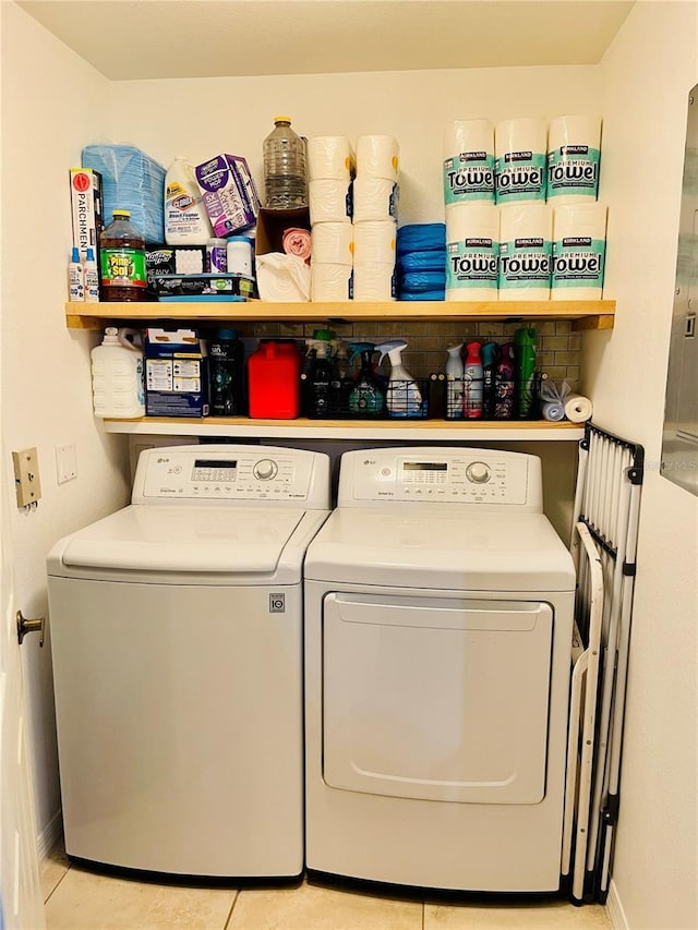 20310 Estero Gardens Cir Unit 203, Estero, FL 33928 - laundry room with washer and clothes dryer, baseboards, and light tile patterned floors