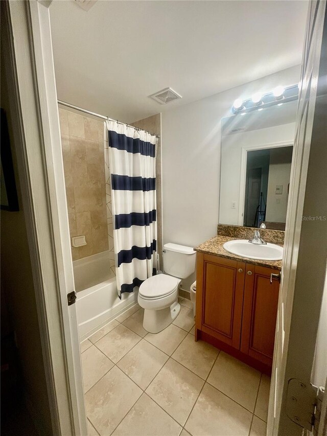 20310 Estero Gardens Cir Unit 203, Estero, FL 33928 - full bathroom featuring toilet, tile patterned flooring, vanity, and shower / bath combo