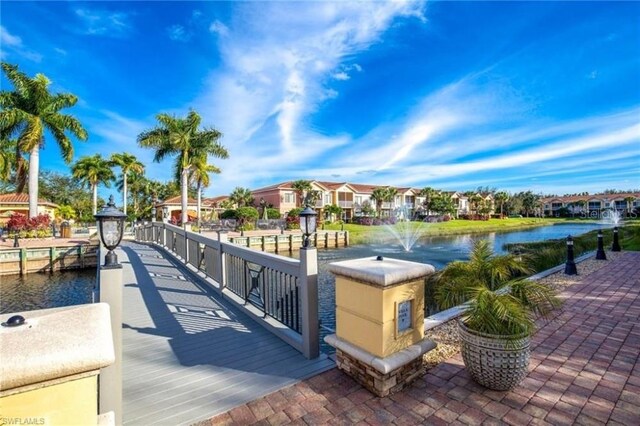 20310 Estero Gardens Cir Unit 203, Estero, FL 33928 - dock with a water view and a residential view