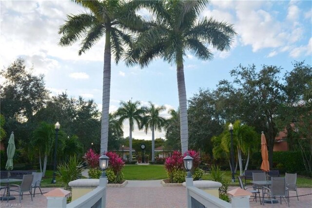 20310 Estero Gardens Cir Unit 203, Estero, FL 33928 - view of home's community with a patio and outdoor dining area