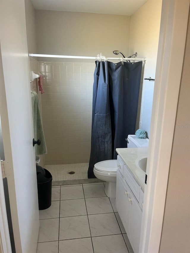 5052 Trekell St, North Port, FL 34287 - bathroom with vanity, toilet, tile patterned floors, and a stall shower