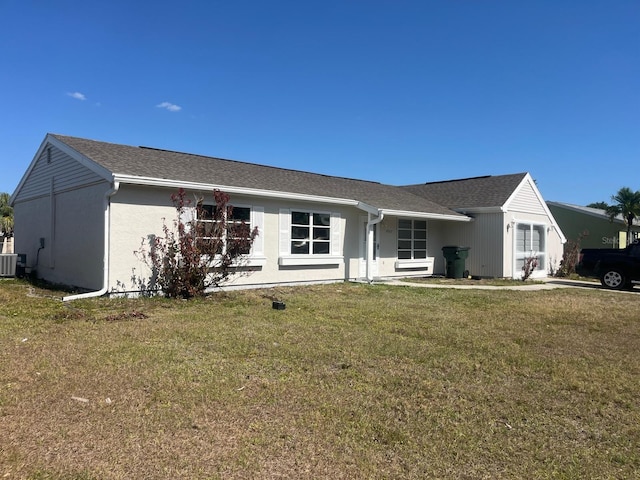 5052 Trekell St, North Port, FL 34287 - ranch-style home featuring cooling unit and a front lawn