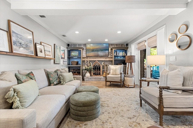 2105 Fosgate Dr, Winter Park, FL 32789 - living room featuring crown molding, visible vents, recessed lighting, a fireplace, and wood finished floors
