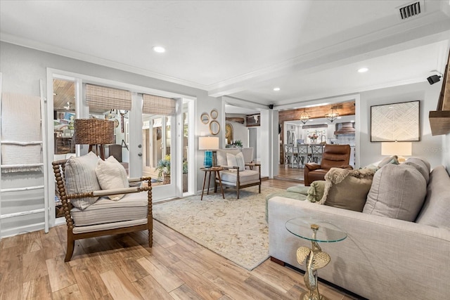 2105 Fosgate Dr, Winter Park, FL 32789 - living room featuring wood finished floors, visible vents, recessed lighting, and ornamental molding