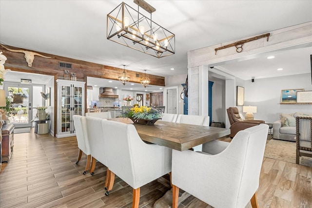 2105 Fosgate Dr, Winter Park, FL 32789 - dining space with visible vents, recessed lighting, an inviting chandelier, and light wood finished floors