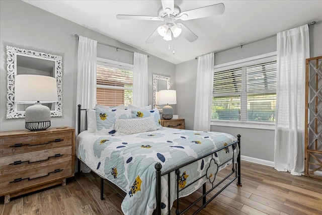 2105 Fosgate Dr, Winter Park, FL 32789 - bedroom with multiple windows, wood finished floors, and baseboards
