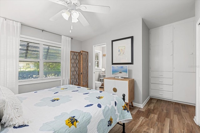 2105 Fosgate Dr, Winter Park, FL 32789 - bedroom featuring baseboards, wood finished floors, ceiling fan, and ensuite bath