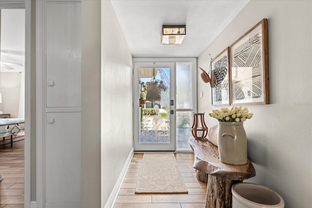 2105 Fosgate Dr, Winter Park, FL 32789 - doorway with baseboards and wood finished floors