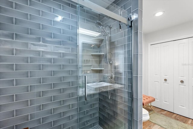 2105 Fosgate Dr, Winter Park, FL 32789 - full bath featuring toilet, a shower stall, and wood finished floors