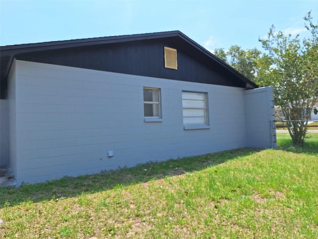 2202 Whitney Pl, Valrico, FL 33594 - view of property exterior with a lawn and concrete block siding