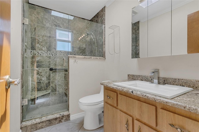 full bathroom featuring vanity, toilet, tile patterned flooring, and a stall shower