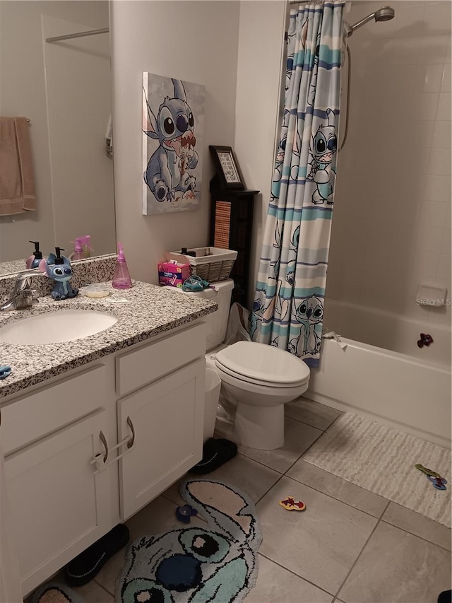 bathroom featuring shower / bath combo with shower curtain, tile patterned flooring, toilet, and vanity
