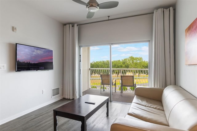 225 Celebration Pl Unit 401, Kissimmee, FL 34747 - living area with wood finished floors, a ceiling fan, and baseboards