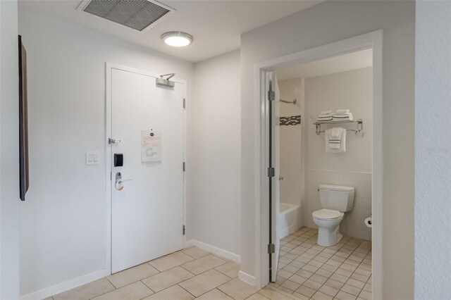 225 Celebration Pl Unit 401, Kissimmee, FL 34747 - full bathroom featuring tile patterned flooring, toilet, and shower / bath combination