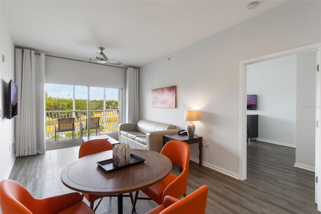 225 Celebration Pl Unit 401, Kissimmee, FL 34747 - living area featuring wood finished floors, ceiling fan, and baseboards