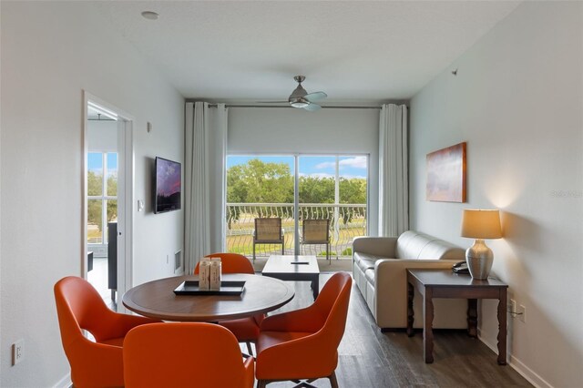 225 Celebration Pl Unit 401, Kissimmee, FL 34747 - dining area with wood finished floors, a ceiling fan, and baseboards