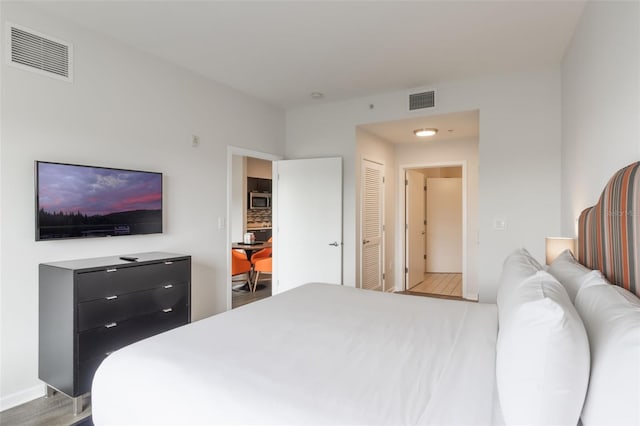 225 Celebration Pl Unit 401, Kissimmee, FL 34747 - bedroom featuring wood finished floors and baseboards