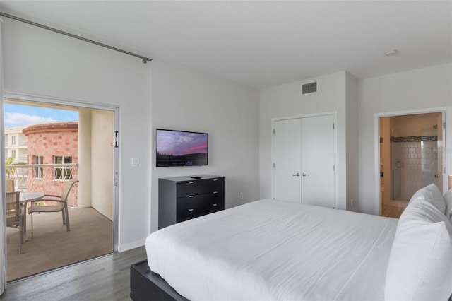 225 Celebration Pl Unit 401, Kissimmee, FL 34747 - bedroom with wood finished floors and ensuite bathroom