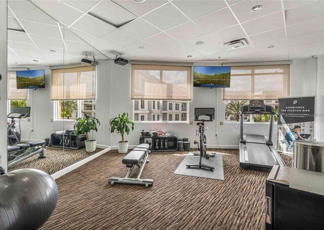 225 Celebration Pl Unit 401, Kissimmee, FL 34747 - workout area with baseboards, carpet, and a drop ceiling