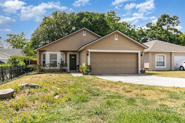 ranch-style home with a front yard, a garage, fence, concrete driveway, and stucco siding