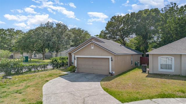 ranch-style home with fence, driveway, and a front yard