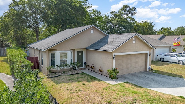 ranch-style home with driveway, a front yard, fence, an attached garage, and stucco siding