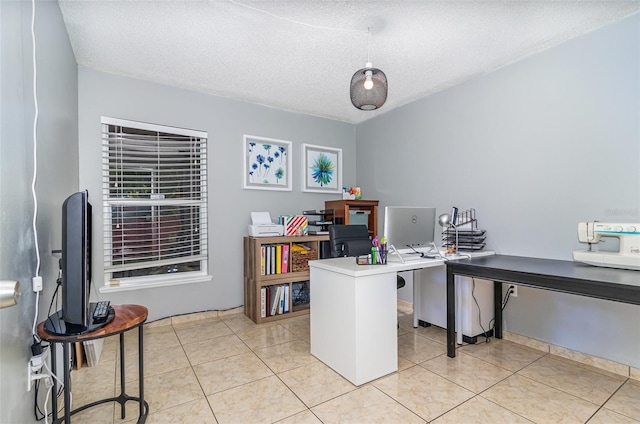 office area featuring light tile patterned flooring and a textured ceiling