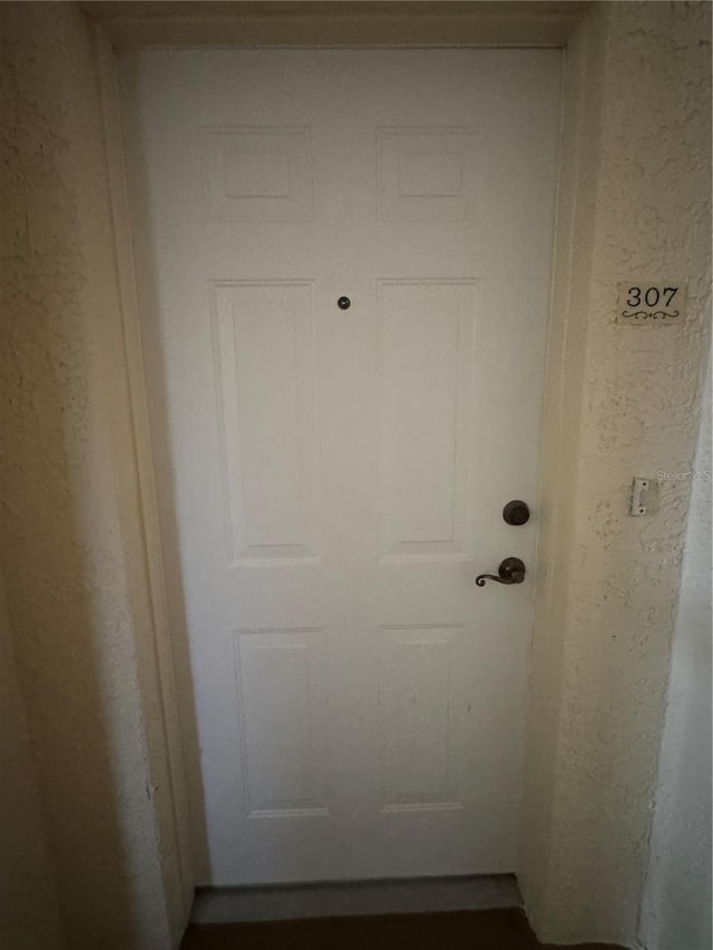 6336 Buford St Unit 307, Orlando, FL 32835 - doorway to outside featuring a textured wall