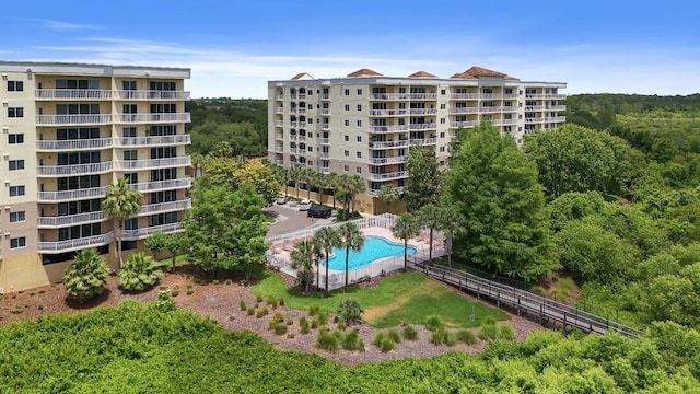 6336 Buford St Unit 307, Orlando, FL 32835 - view of property with a community pool and fence