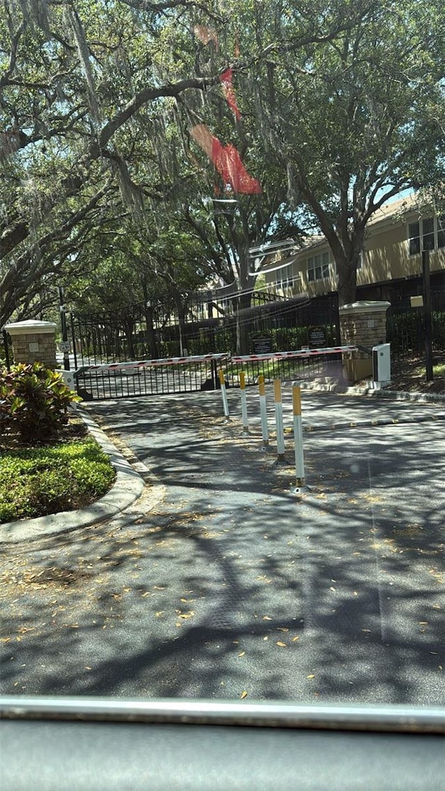 6336 Buford St Unit 307, Orlando, FL 32835 - view of road featuring a gate