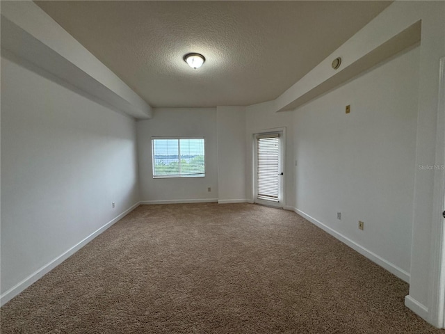 6336 Buford St Unit 307, Orlando, FL 32835 - carpeted empty room featuring a textured ceiling and baseboards
