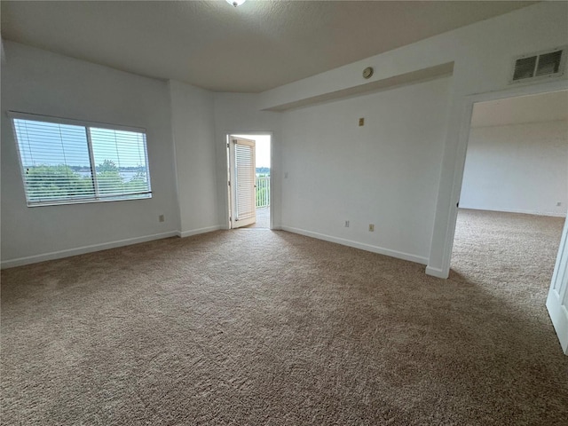 6336 Buford St Unit 307, Orlando, FL 32835 - carpeted empty room with visible vents and baseboards