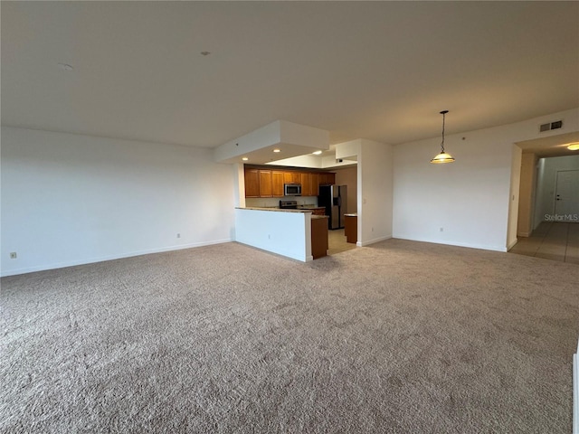 6336 Buford St Unit 307, Orlando, FL 32835 - unfurnished living room with baseboards, visible vents, recessed lighting, and light colored carpet