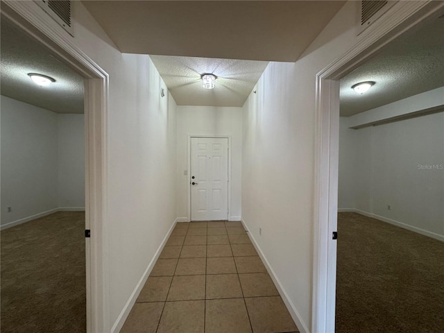 6336 Buford St Unit 307, Orlando, FL 32835 - hallway with a textured ceiling, visible vents, and carpet