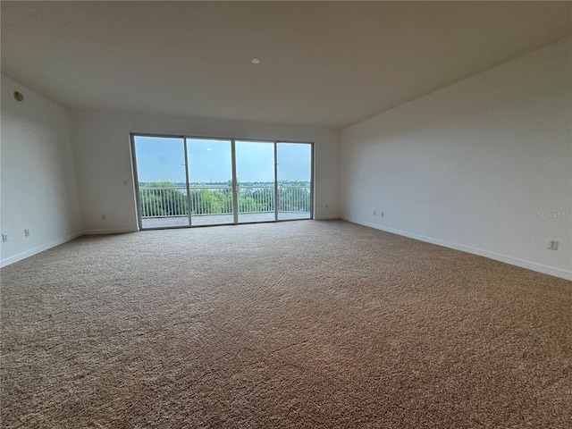 6336 Buford St Unit 307, Orlando, FL 32835 - carpeted empty room featuring baseboards
