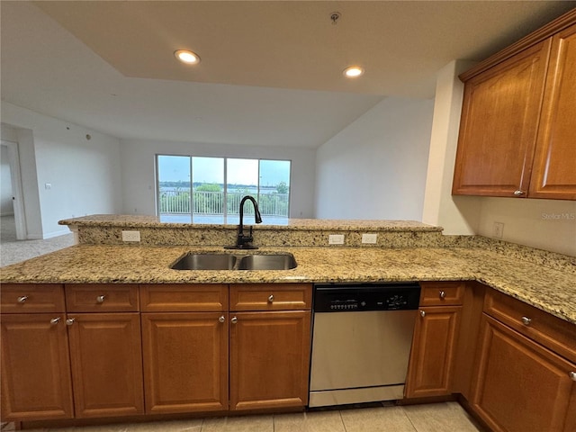 6336 Buford St Unit 307, Orlando, FL 32835 - kitchen with brown cabinetry, dishwasher, a sink, light stone counters, and recessed lighting