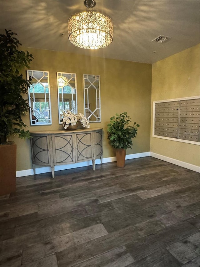 6336 Buford St Unit 307, Orlando, FL 32835 - unfurnished dining area featuring a notable chandelier, baseboards, visible vents, and mail area