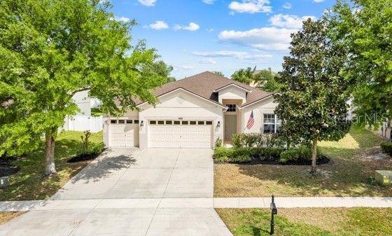 5839 Tarleton Way, Mount Dora, FL 32757 - view of front of property with driveway, a garage, and fence