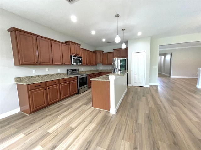 5839 Tarleton Way, Mount Dora, FL 32757 - kitchen with appliances with stainless steel finishes, brown cabinets, pendant lighting, light wood-style floors, and light stone counters