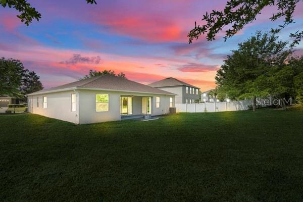 5839 Tarleton Way, Mount Dora, FL 32757 - rear view of property featuring stucco siding