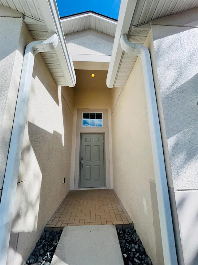 5839 Tarleton Way, Mount Dora, FL 32757 - doorway to property featuring stucco siding