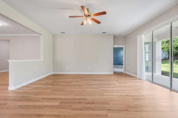 5839 Tarleton Way, Mount Dora, FL 32757 - spare room with light wood-type flooring, baseboards, and ceiling fan